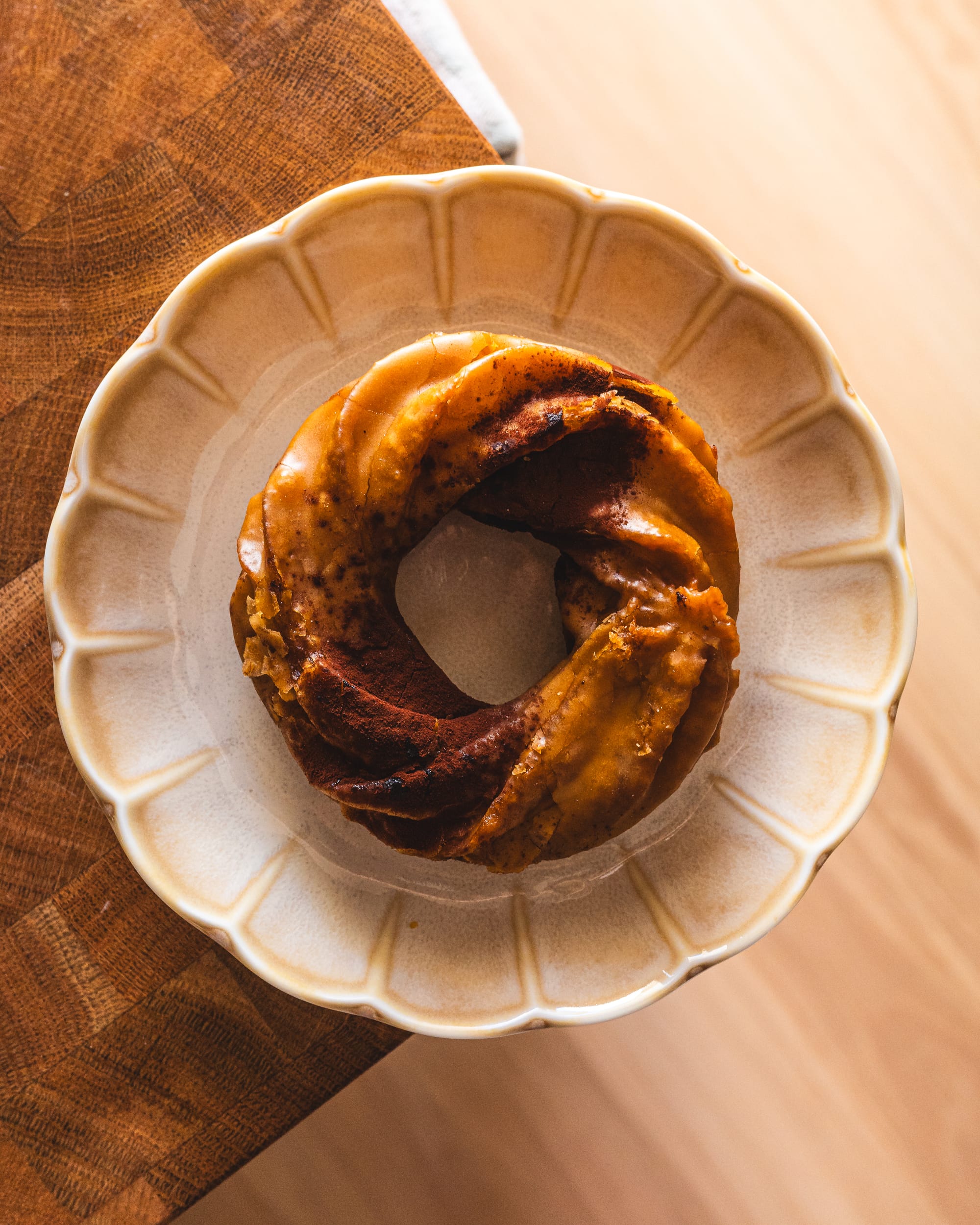 Top down shot of cruller donut on a circular plate  