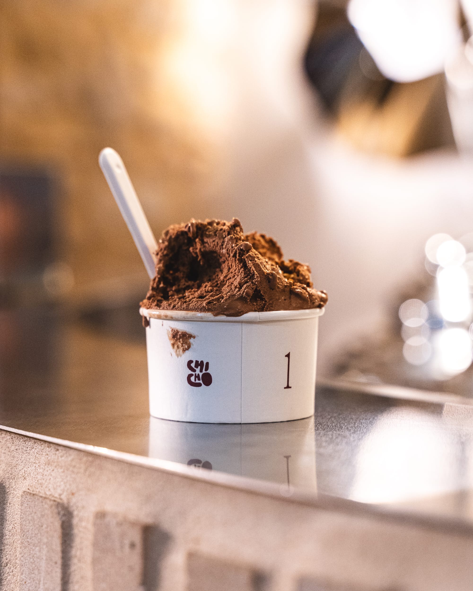 Close up of chocolate gelato in a paper cup