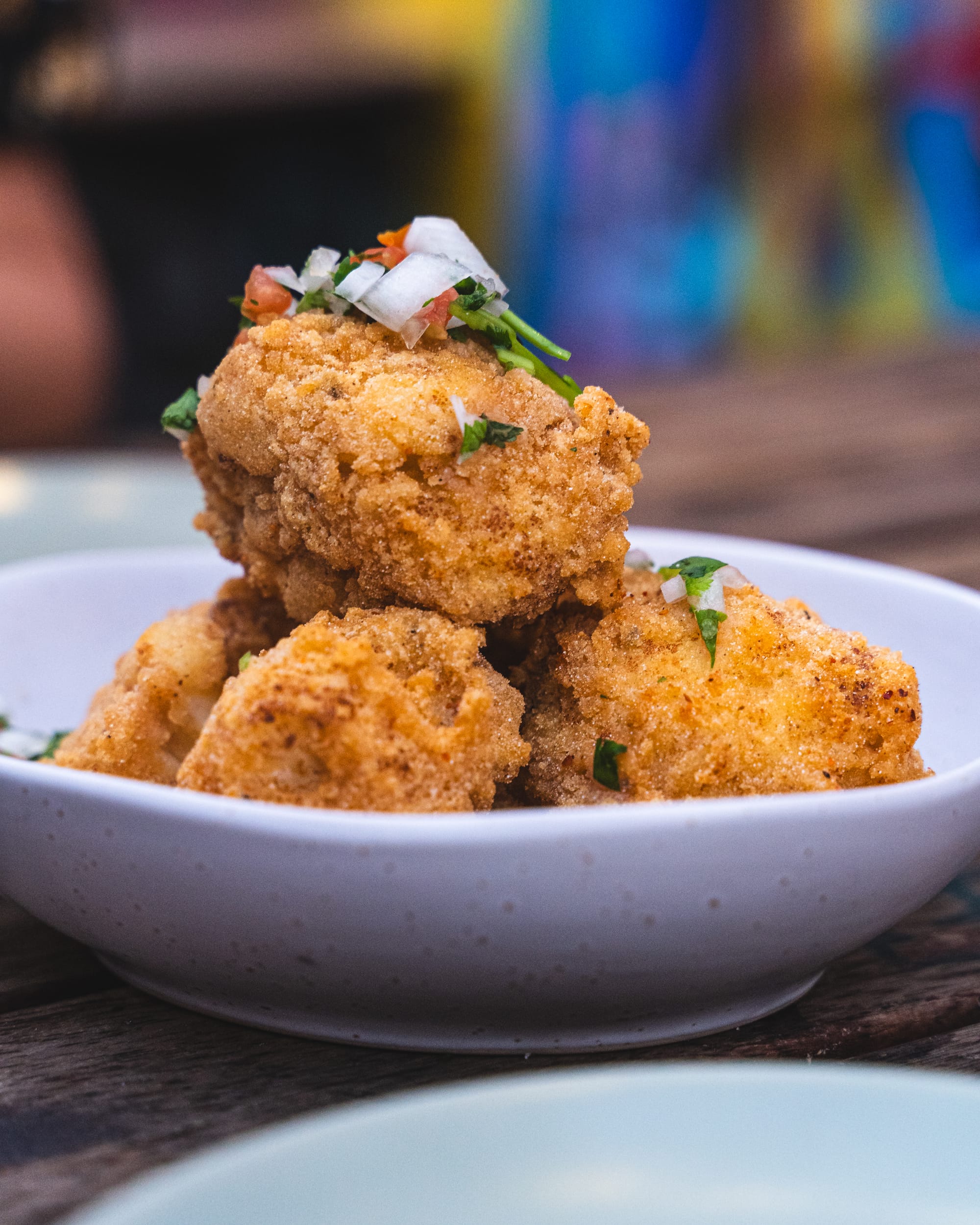 Close up of fried cauliflower in a shallow bowl plate