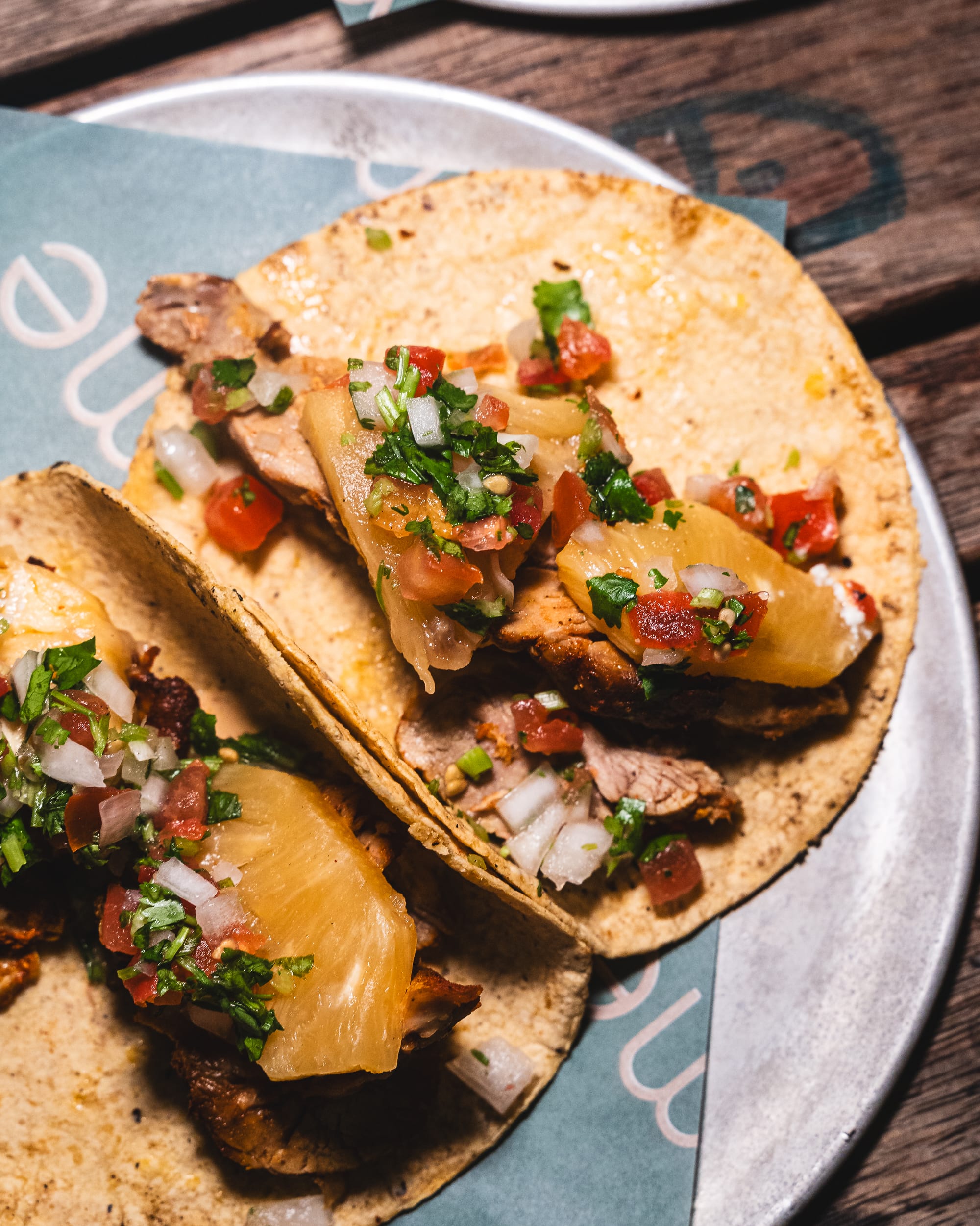 Close up of pork taco with grilled pineapple