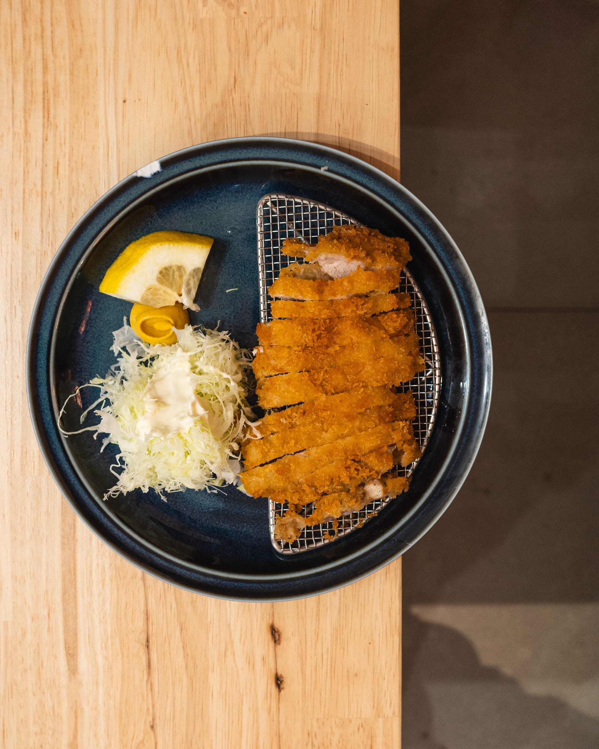 Top down shot of tonkatsu with cabbage