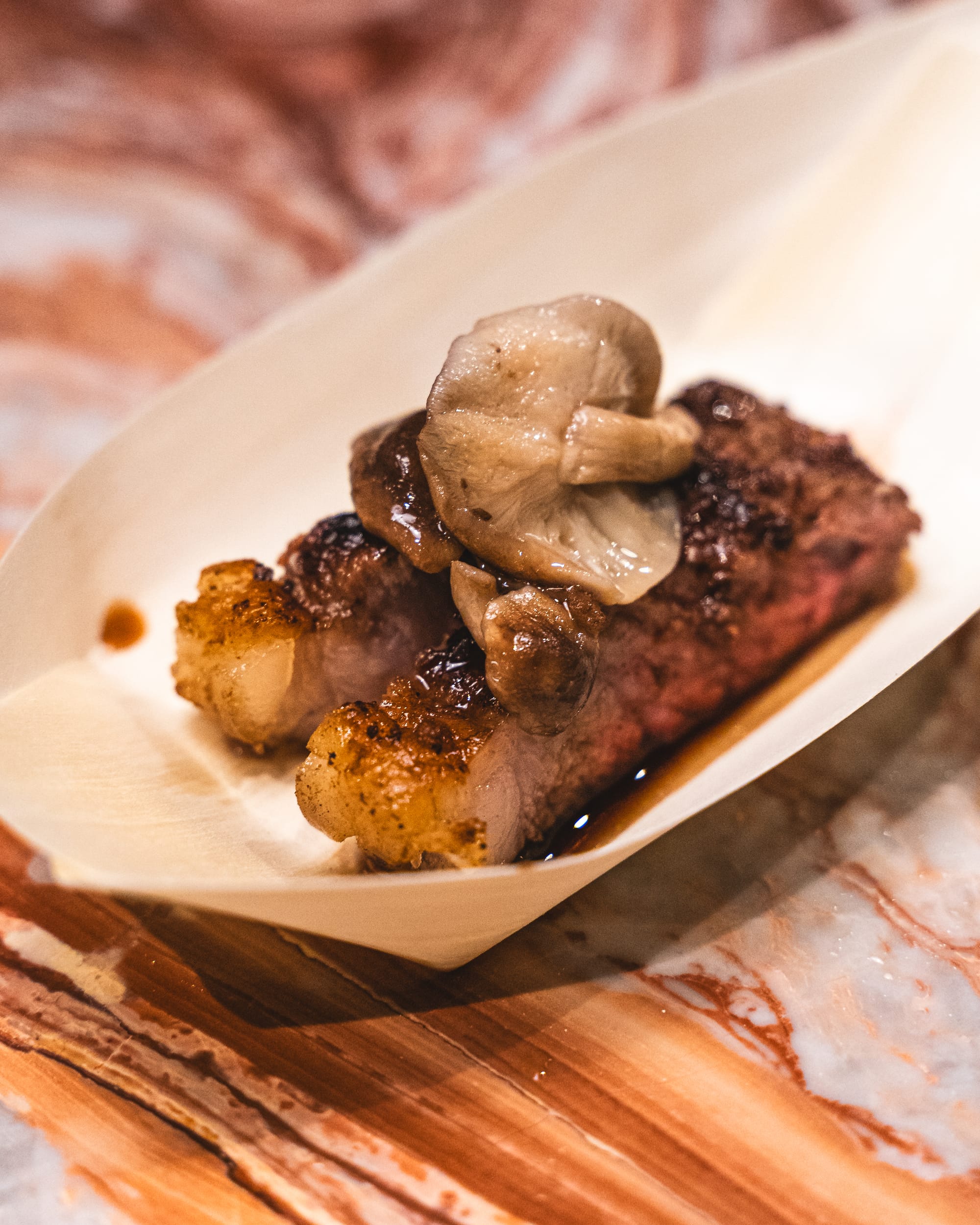 Close up of wagyu beef with mushroom and sauce