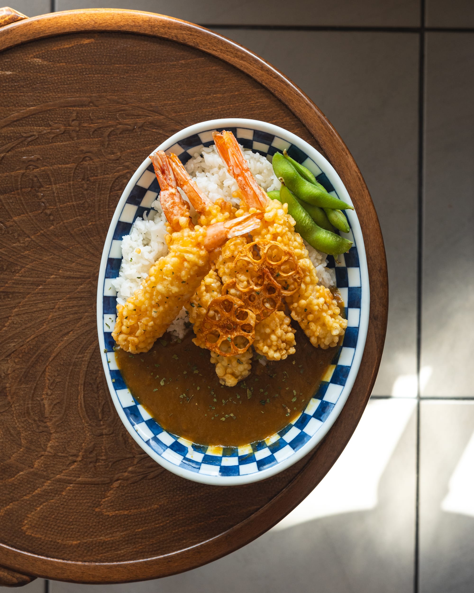 Top down shot of prawn tempura with curry