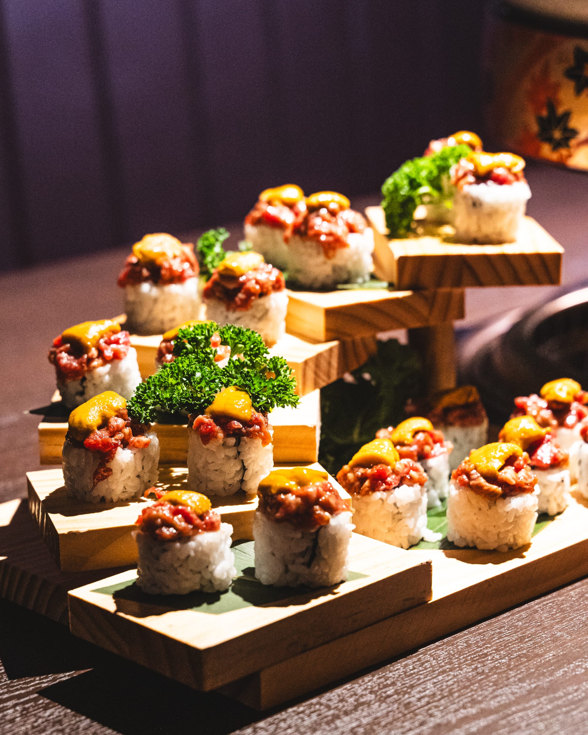 Close up of sushi with raw beef and uni