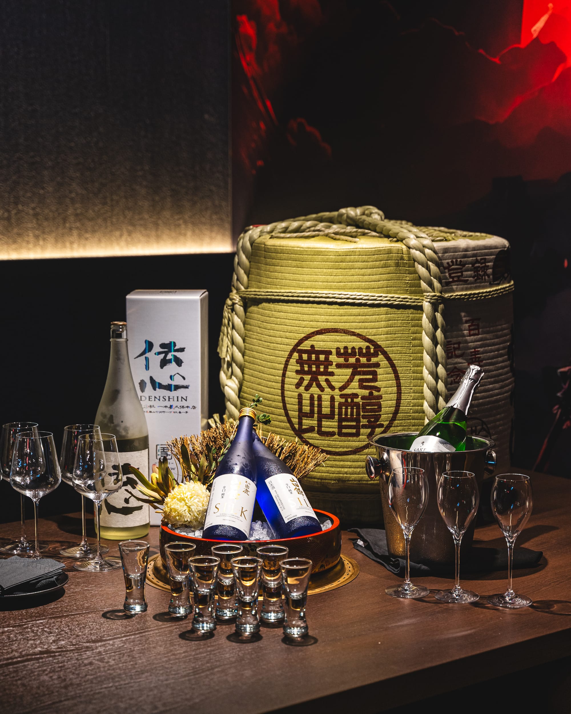 Sake displayed with sake drum, wine glasses and sake glasses