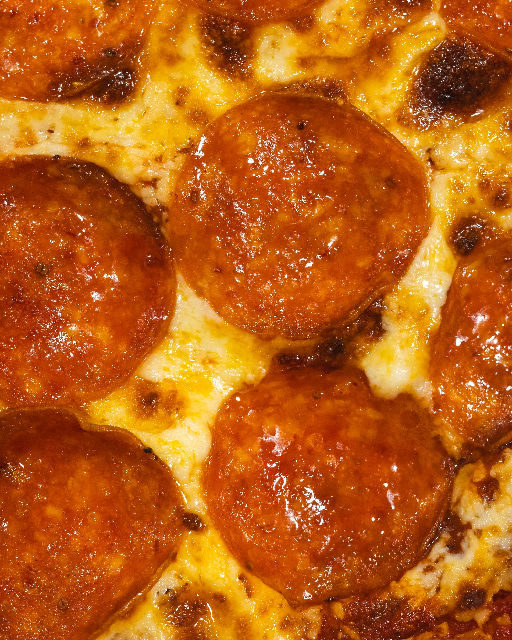 Close up of pepperoni on pizza