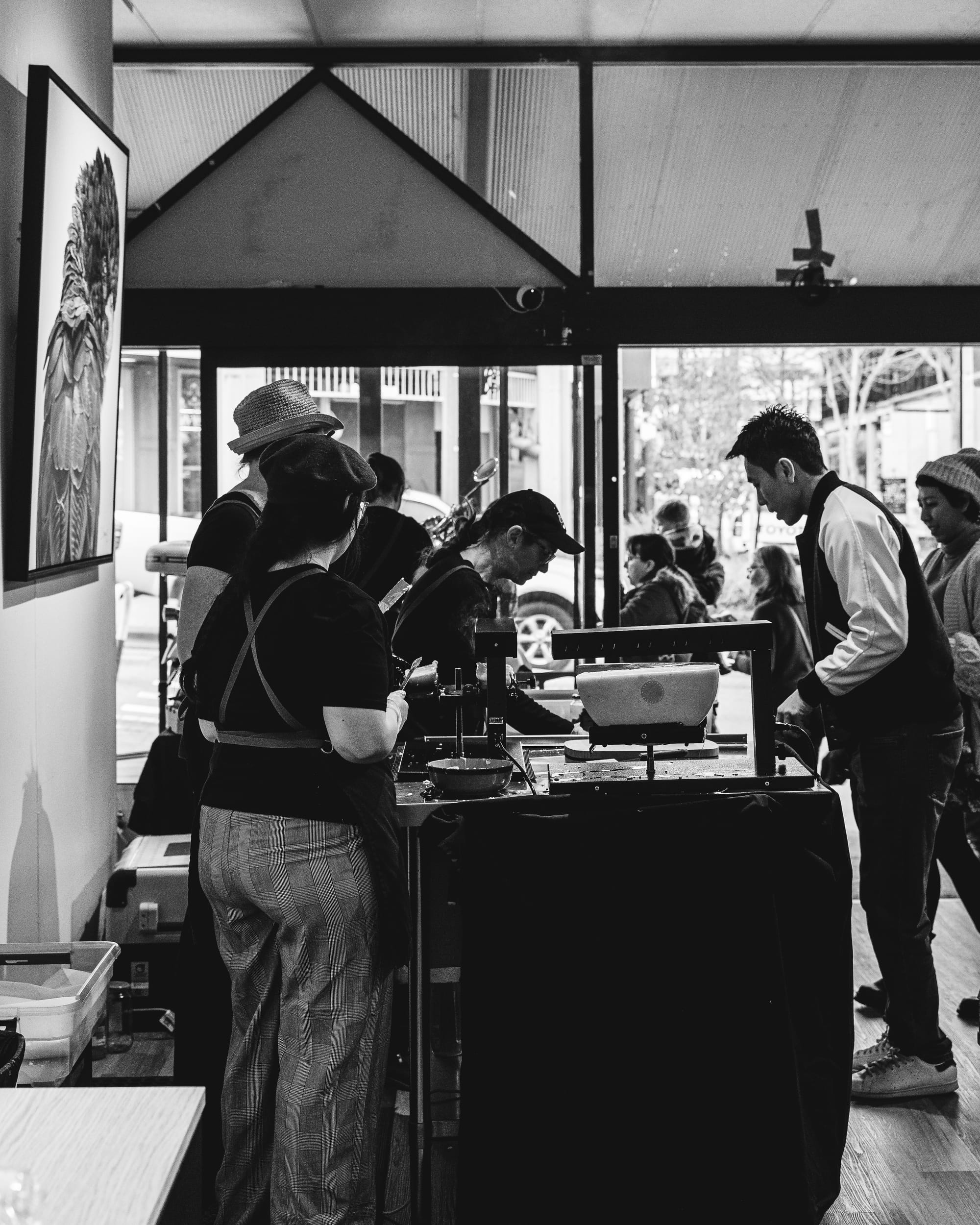 Interior of The Cheese Shop with people carving raclette