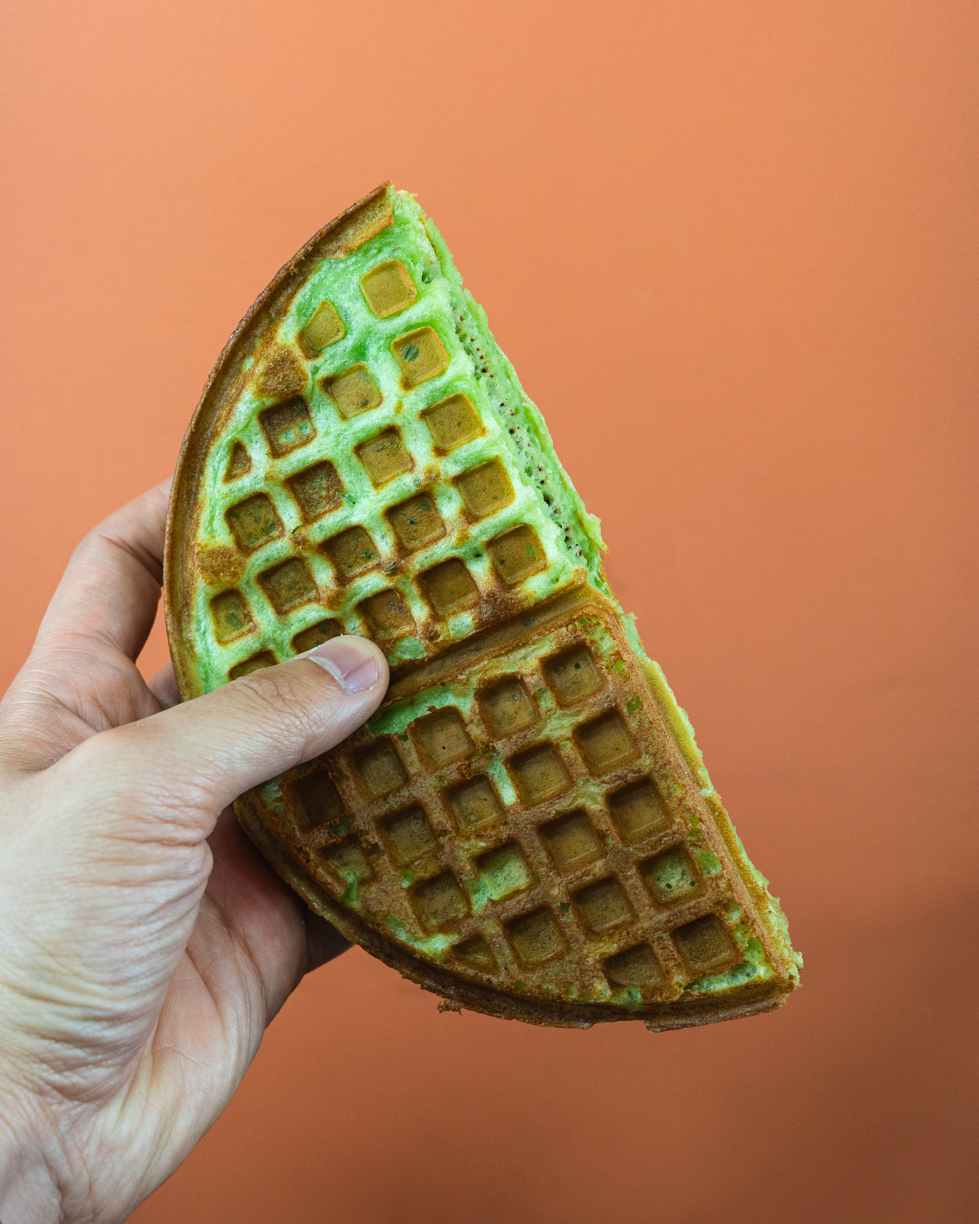 Hand holding pandan waffle