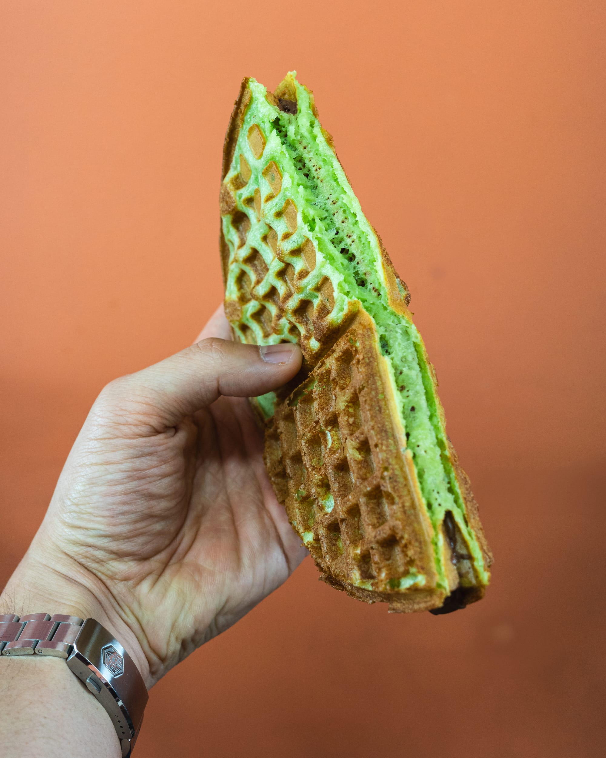 Hand holding pandan waffle