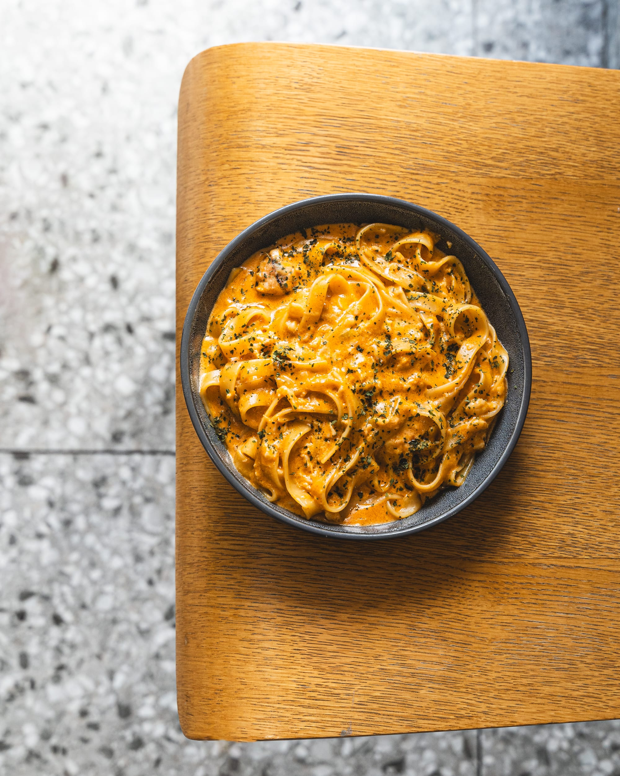 Top down shot of creamy pasta on-top of a chair