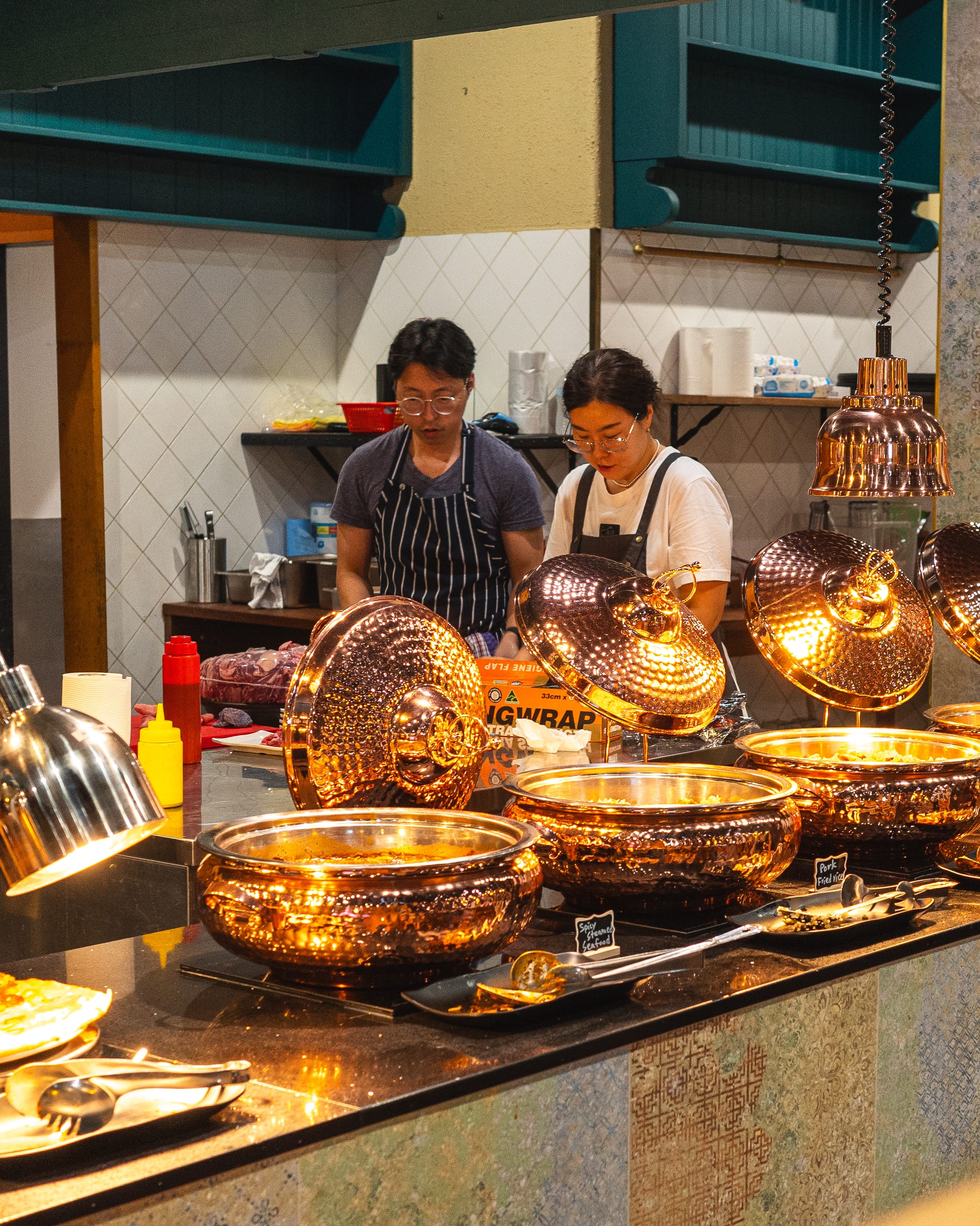 Candid photo of chefs in an open kitchen