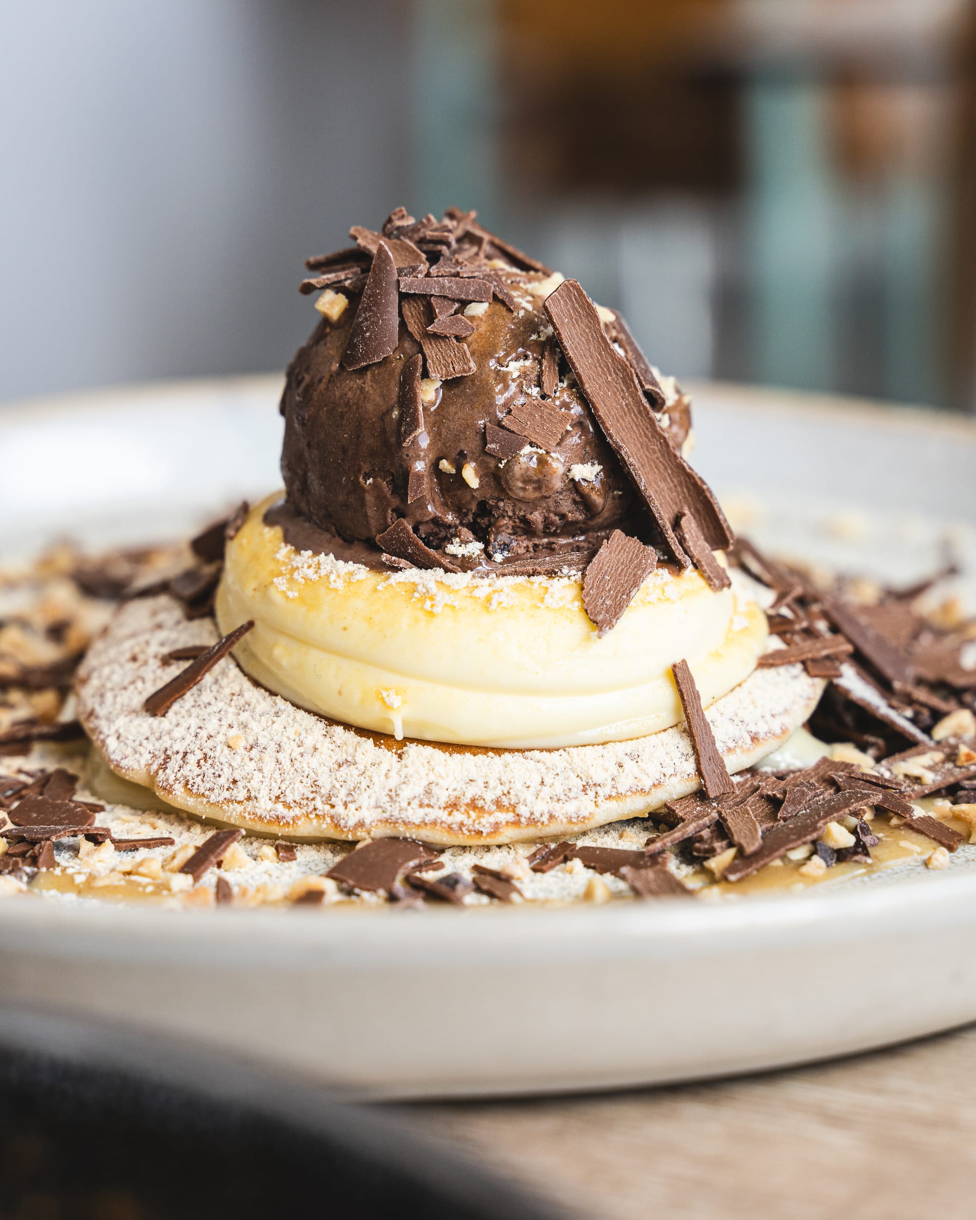 Close up of injeolmi waffles with ice-cream and shaved chocolate