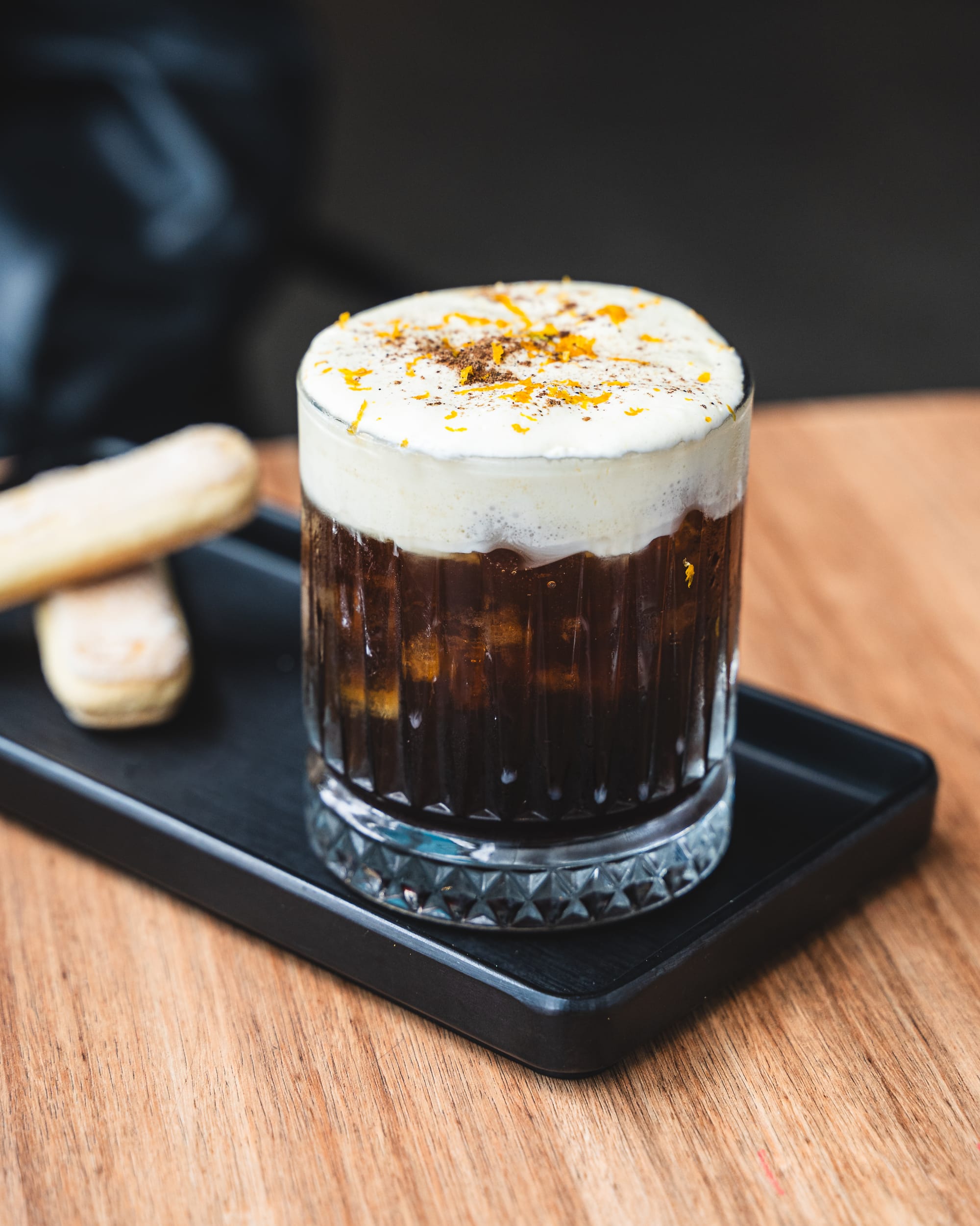 Close up of Mont Blanc coffee with foam and orange peel shavings