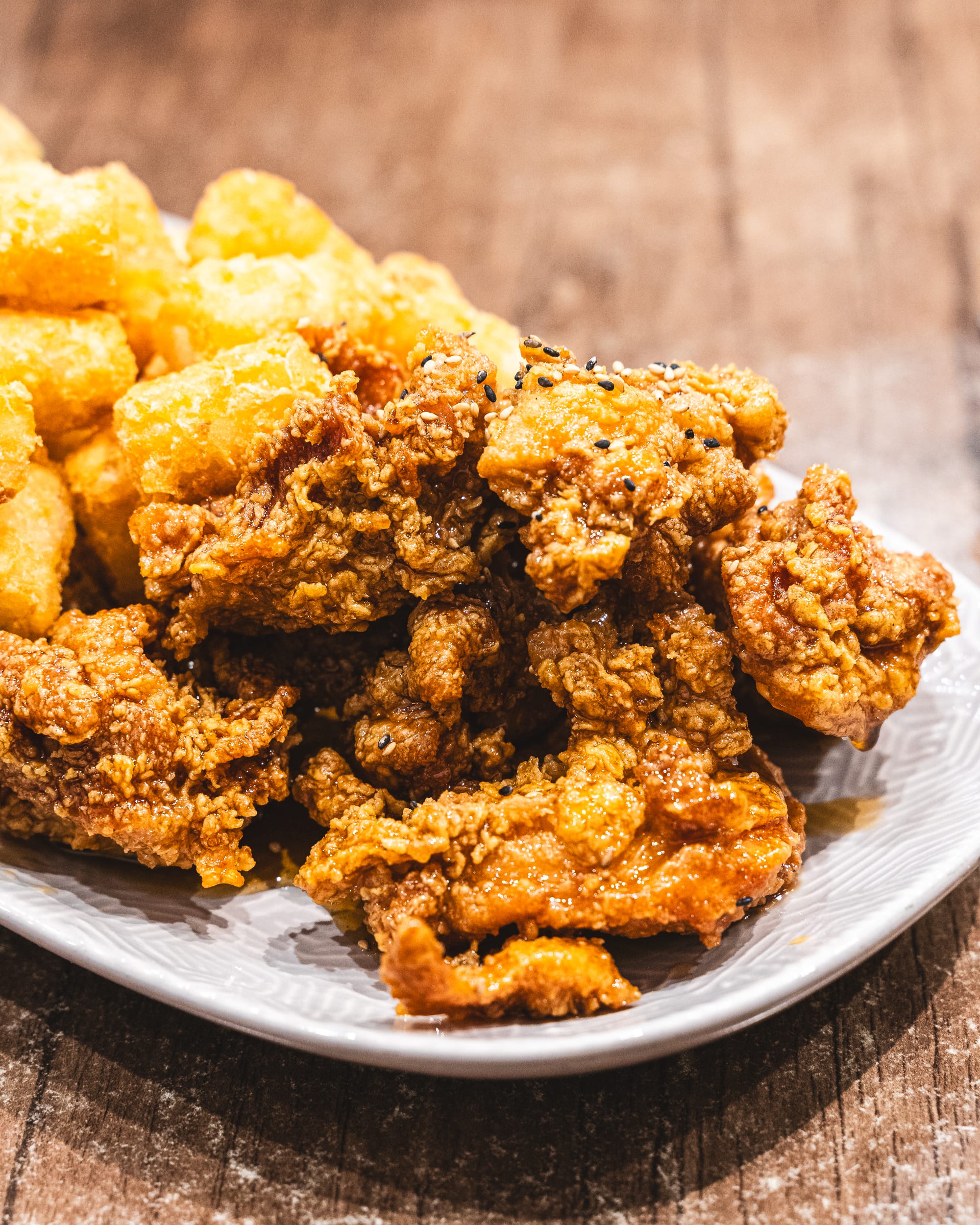 Close up of fried chicken and potato gems