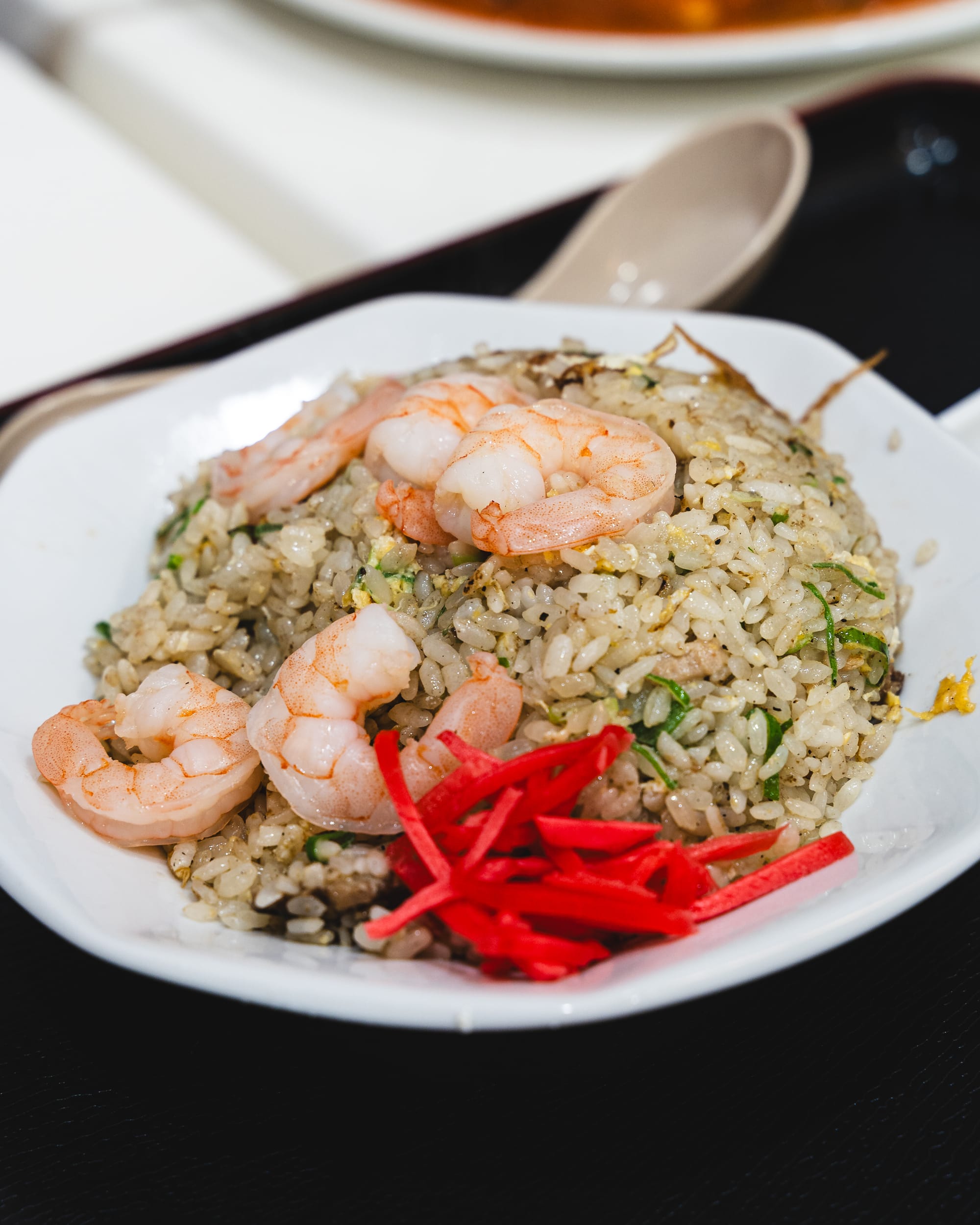 Close up of fried rice with prawns and pickled raddish