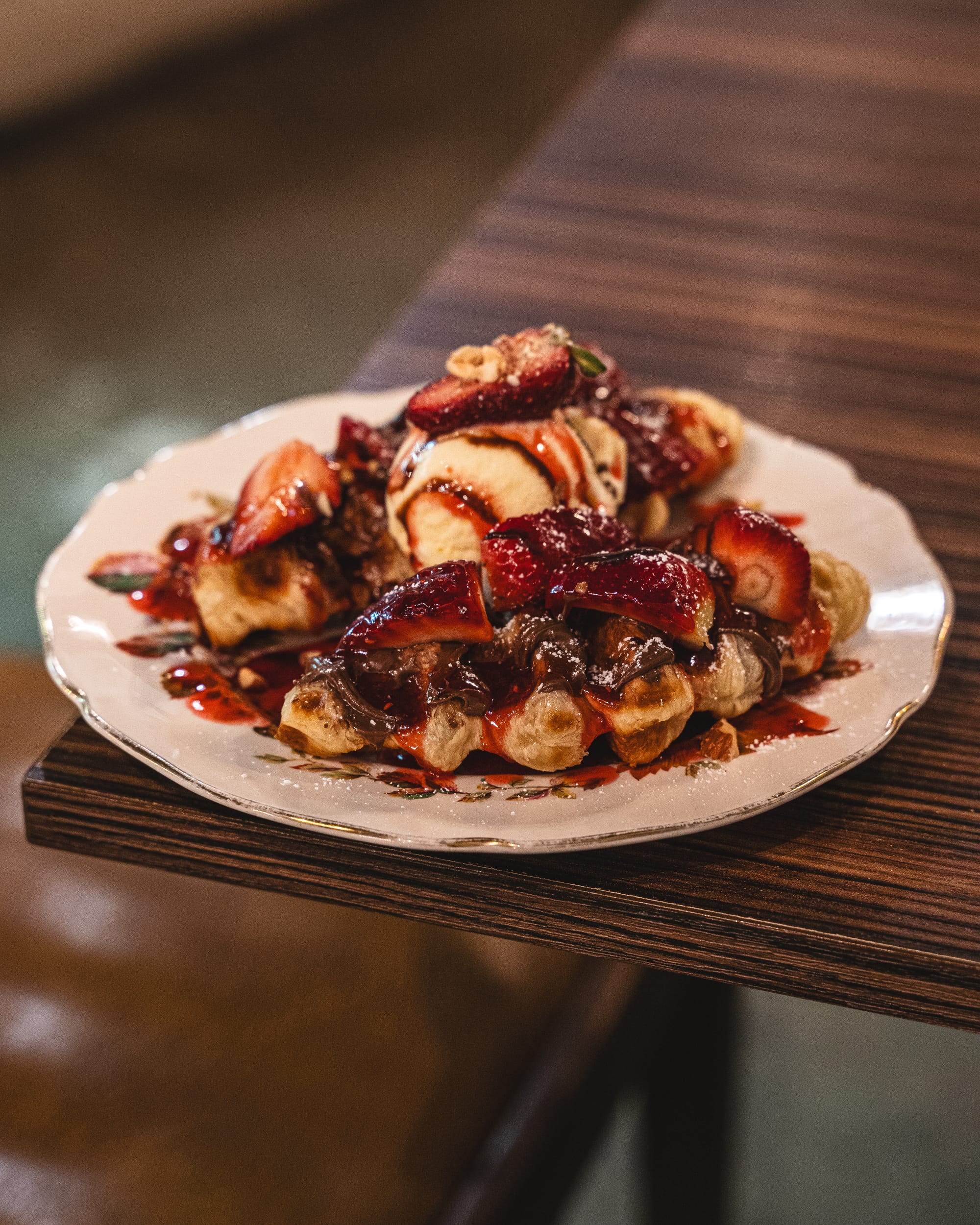 Closeup of croffle topped with Nutella and strawberry