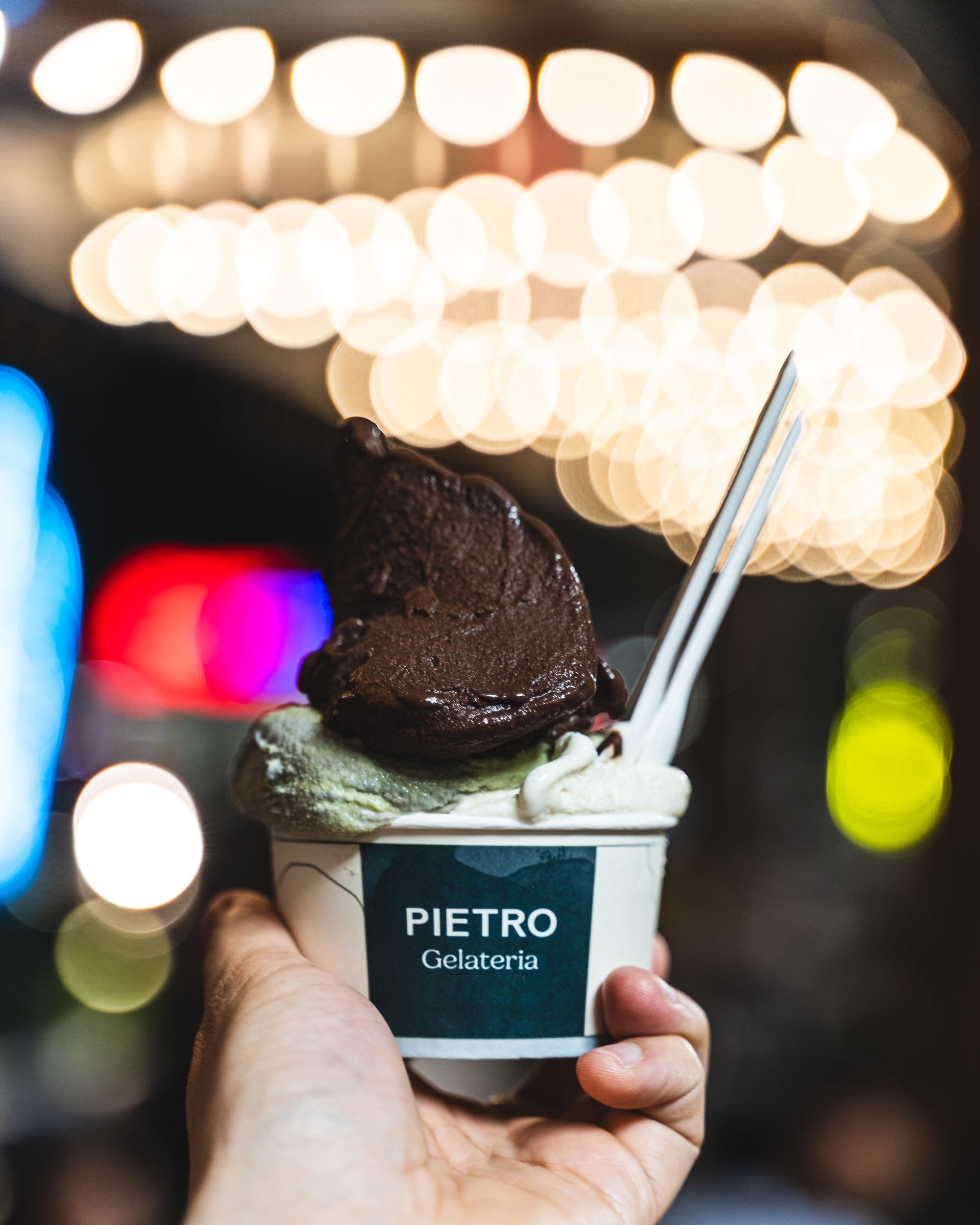 Hand holding cup of gelato