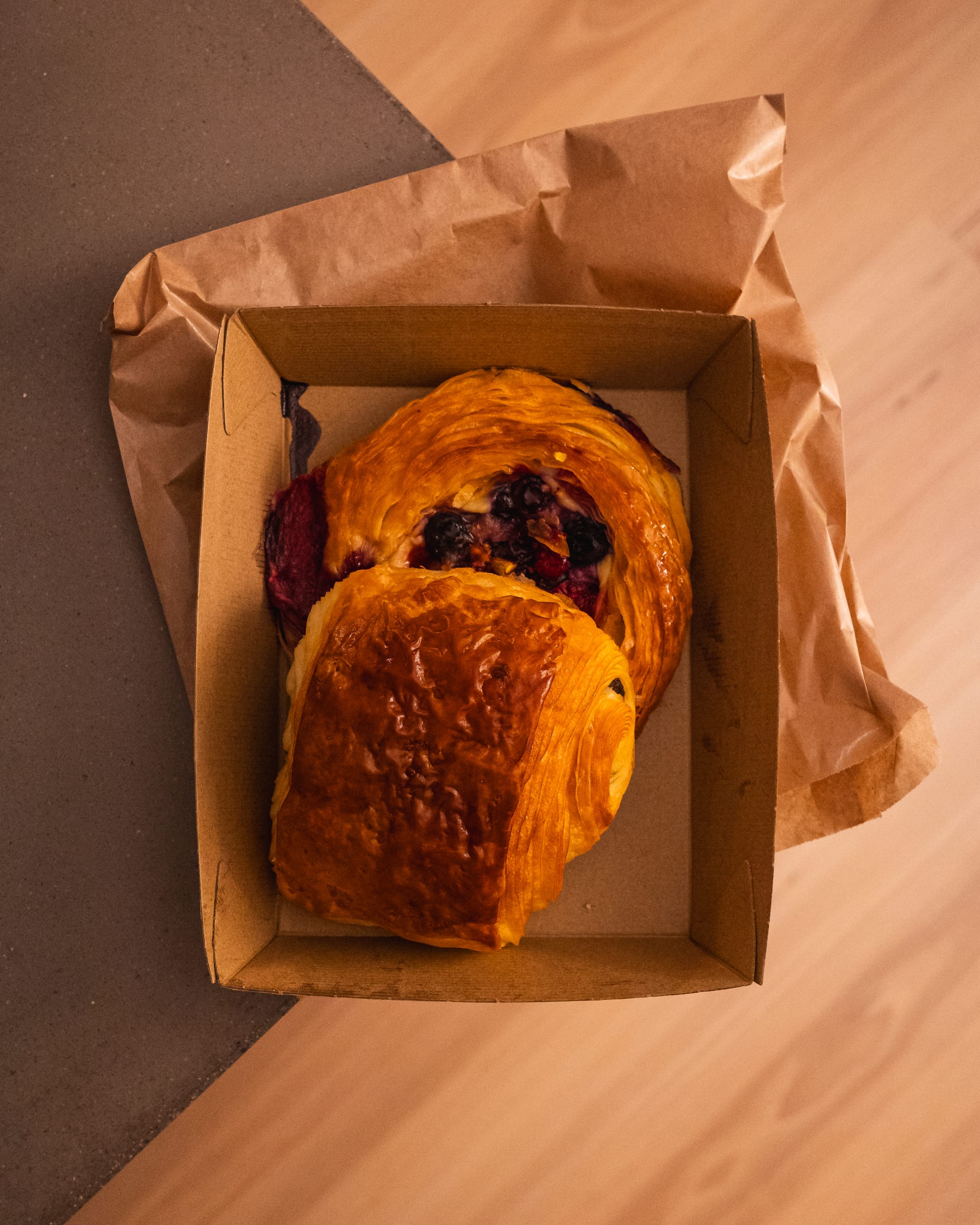 Top down shot of berry danish and pan au cholat