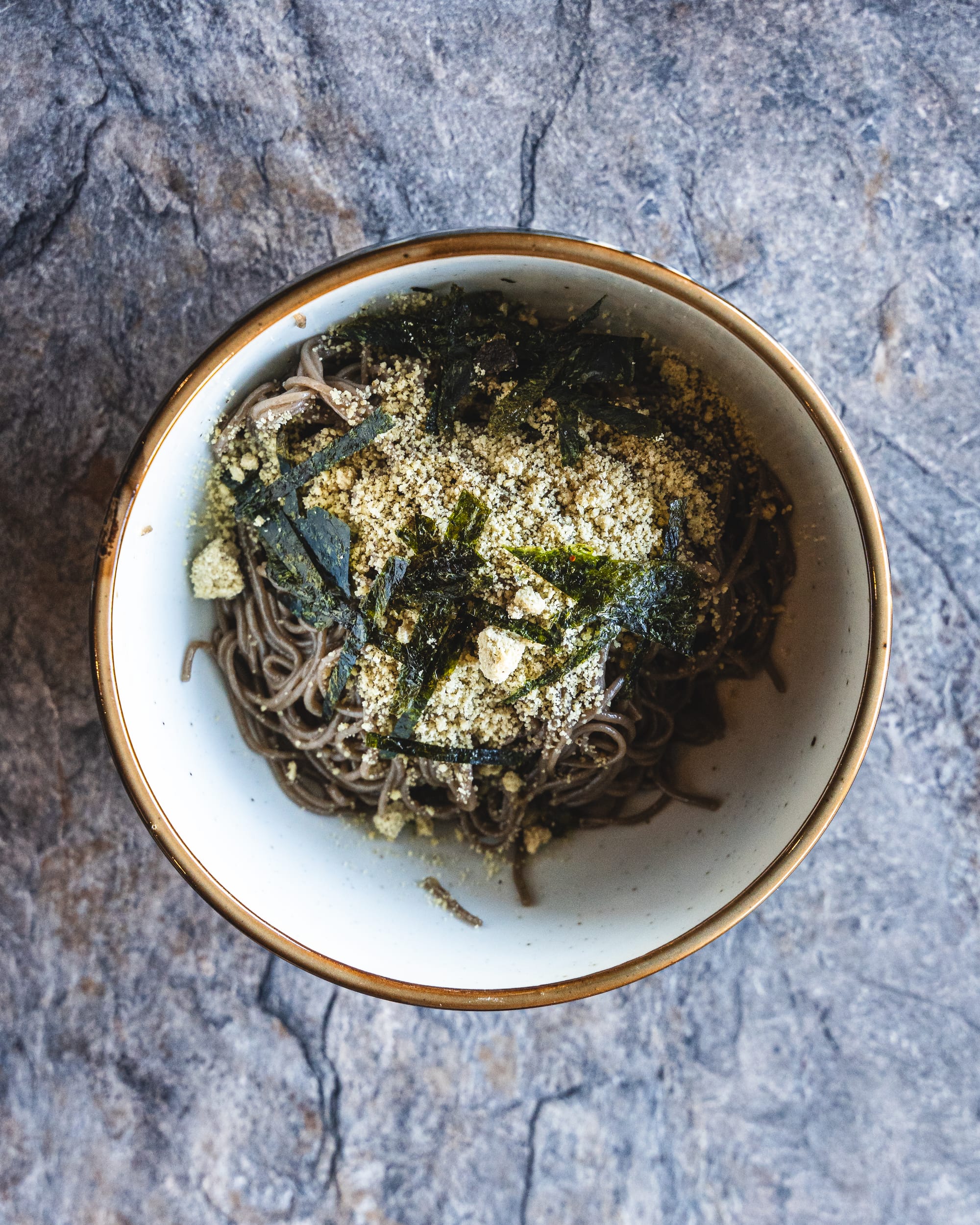 Top down shot of noodles with seaweed on top 