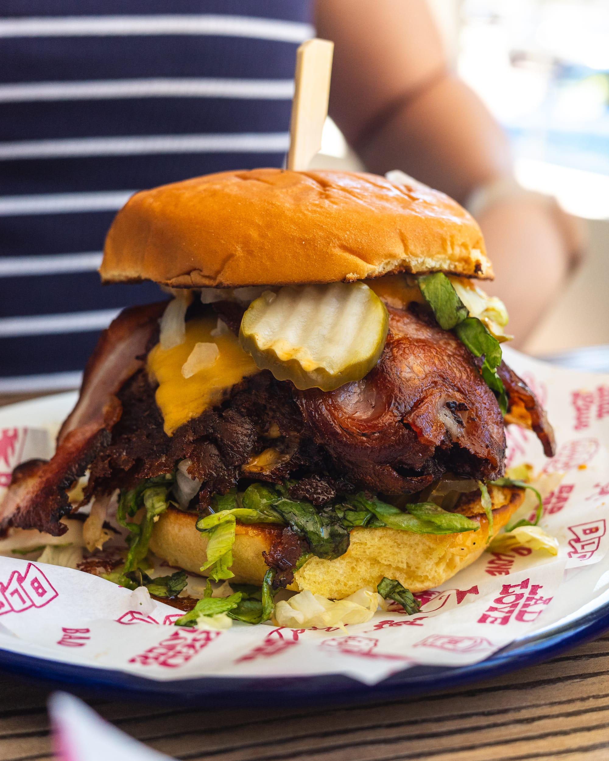 Close up of hamburger with bacon, cheese and pickles