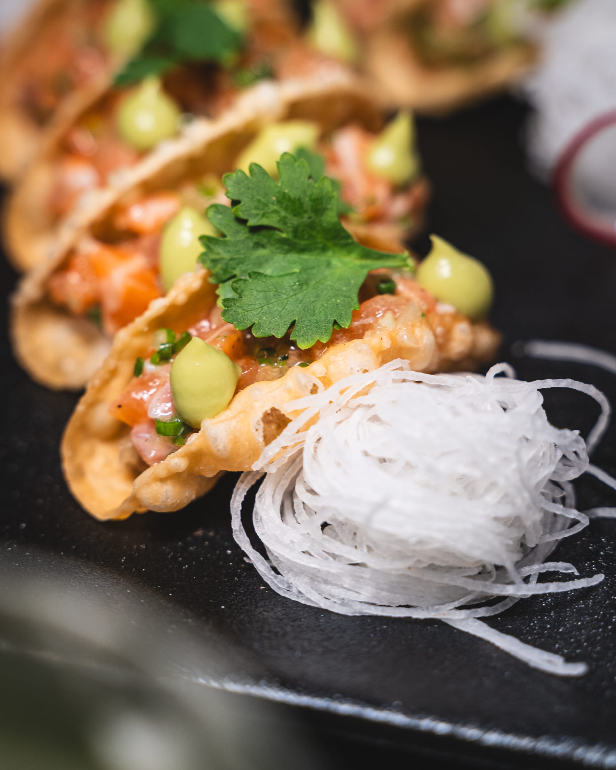 Close up of taco topped with coriander