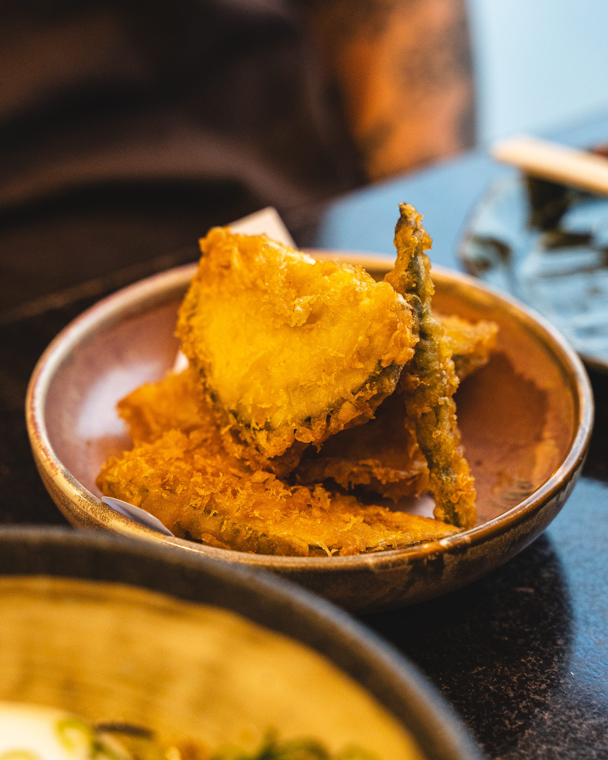 A close-up of deep-fried tempura with a golden crispy texture.