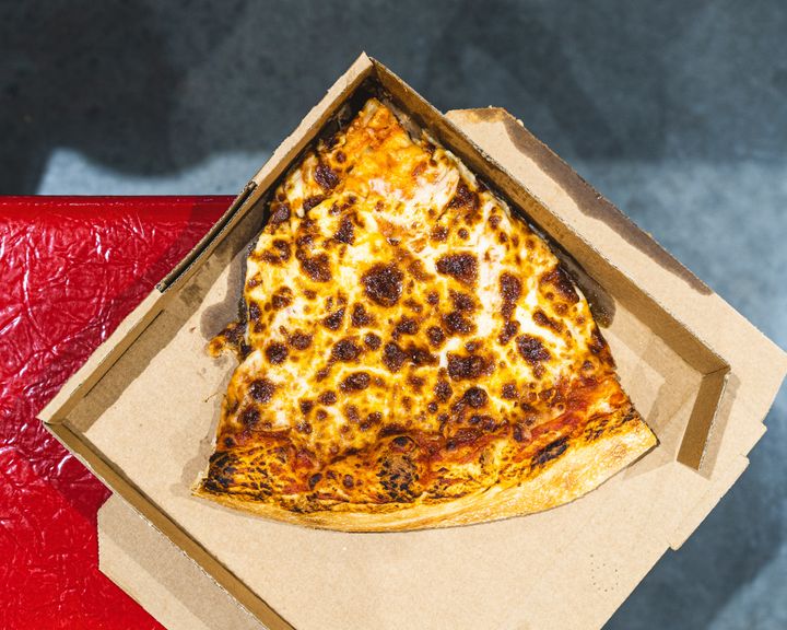 Overhead shot of a big slice of cheese pizza