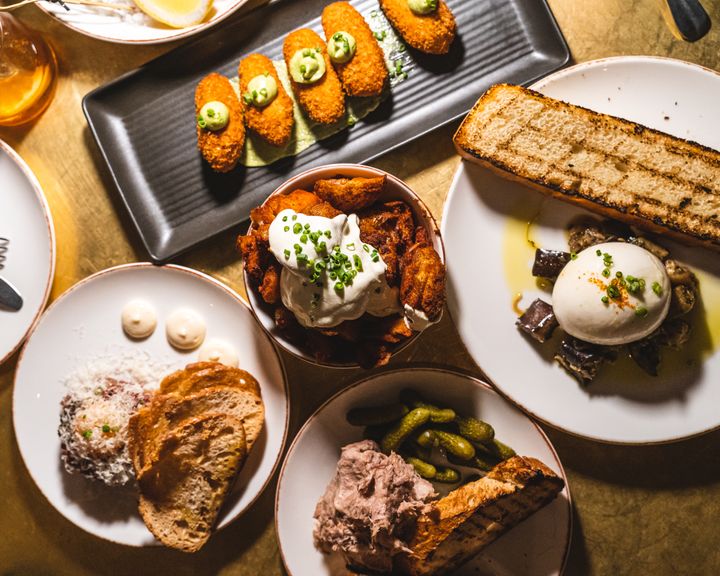 An overhead shot of a spread of food on a table