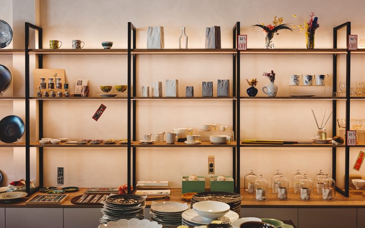 Interior of Japanese homewares store showing lots of different plates, bowls and mugs