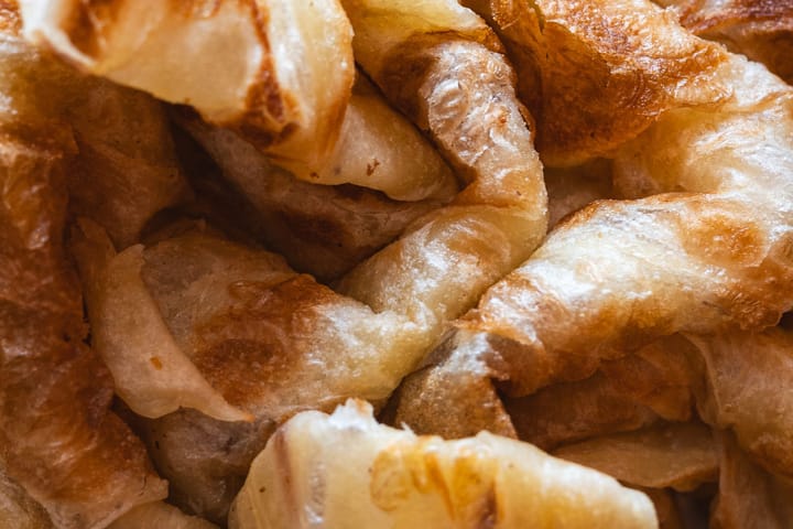 Close-up of flaky and layered roti bread